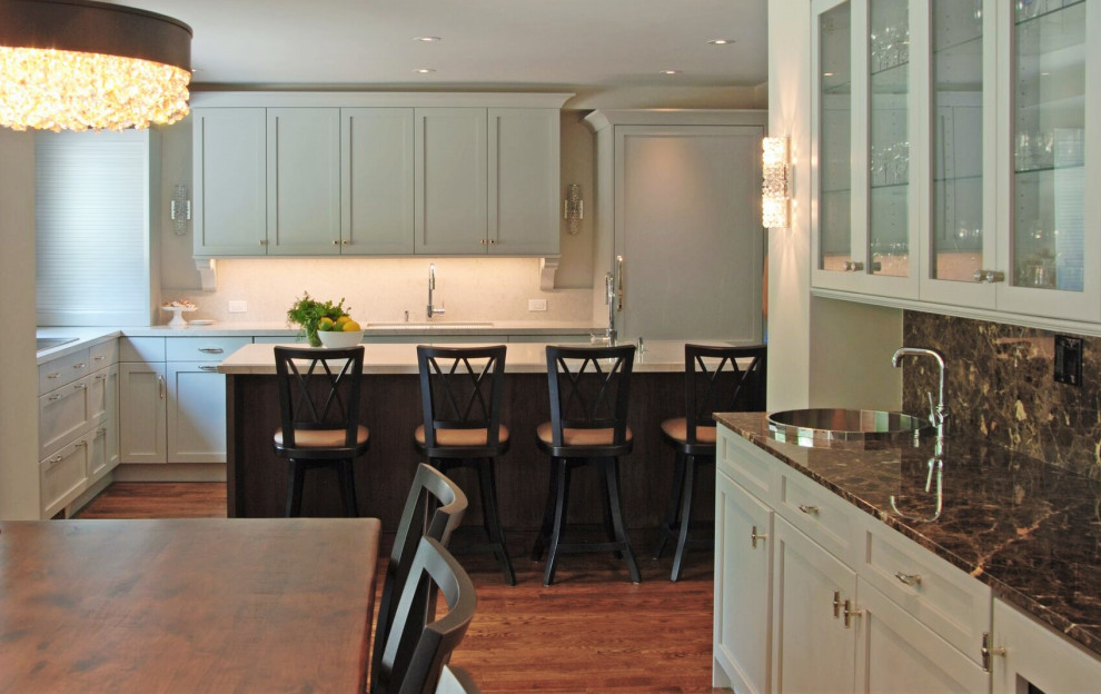 Mid-sized transitional l-shaped medium tone wood floor open concept kitchen photo with an undermount sink, recessed-panel cabinets, blue cabinets, quartz countertops, white backsplash, quartz backsplash, an island and white countertops