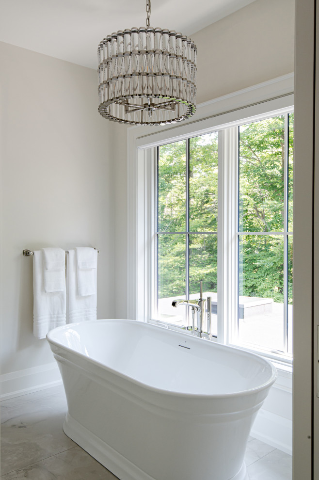 Freestanding bathtub - mid-sized transitional master porcelain tile and multicolored floor freestanding bathtub idea in Toronto with white walls