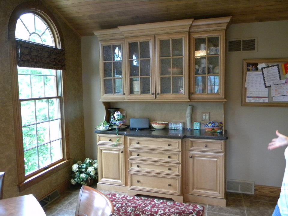 Inspiration for a mid-sized timeless ceramic tile eat-in kitchen remodel with recessed-panel cabinets and light wood cabinets