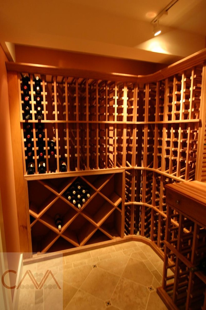 Mid-sized country wine cellar in New York with ceramic floors and storage racks.