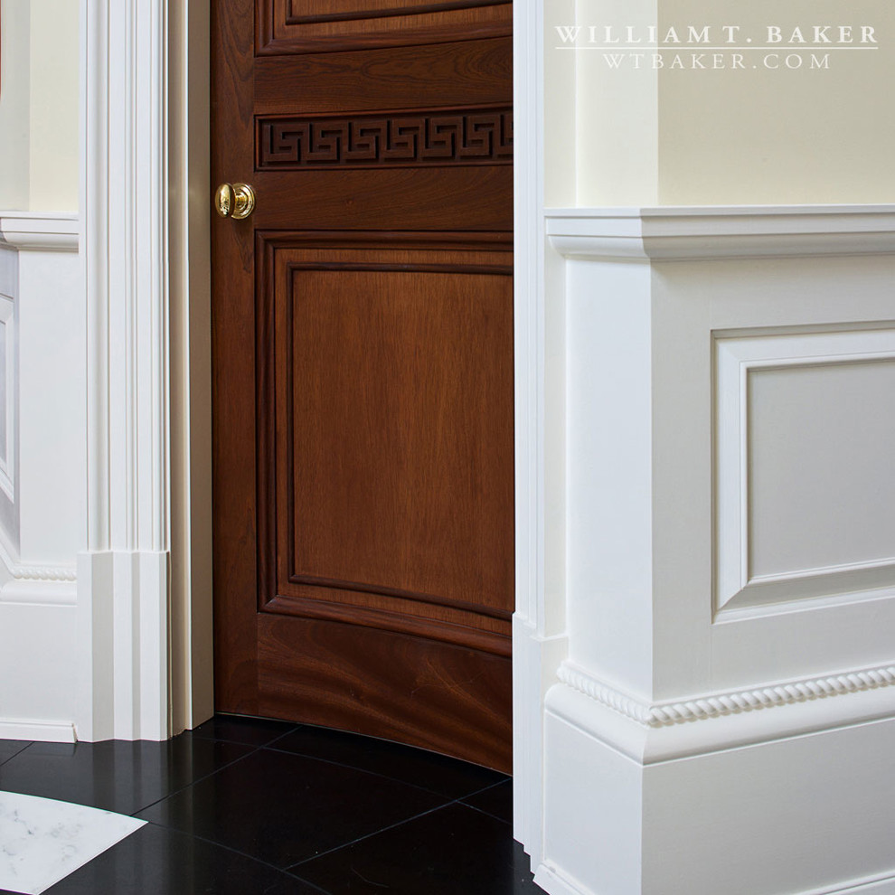 Photo of a traditional hallway in Atlanta with white walls and marble floors.