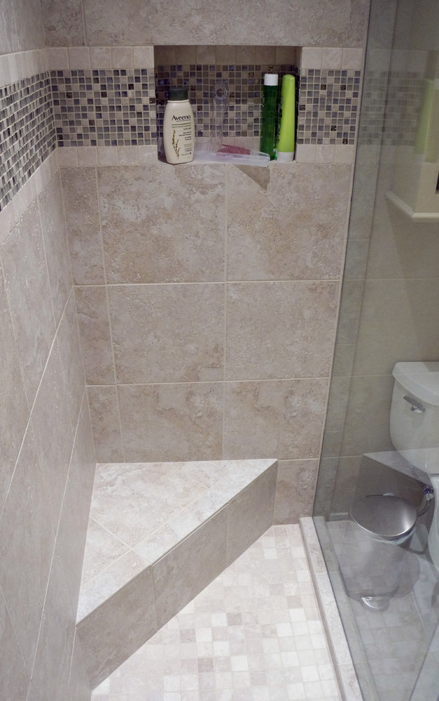 This is an example of a small transitional bathroom in Houston with an undermount sink, flat-panel cabinets, beige cabinets, engineered quartz benchtops, an alcove shower, a two-piece toilet, beige tile, porcelain tile, beige walls and porcelain floors.