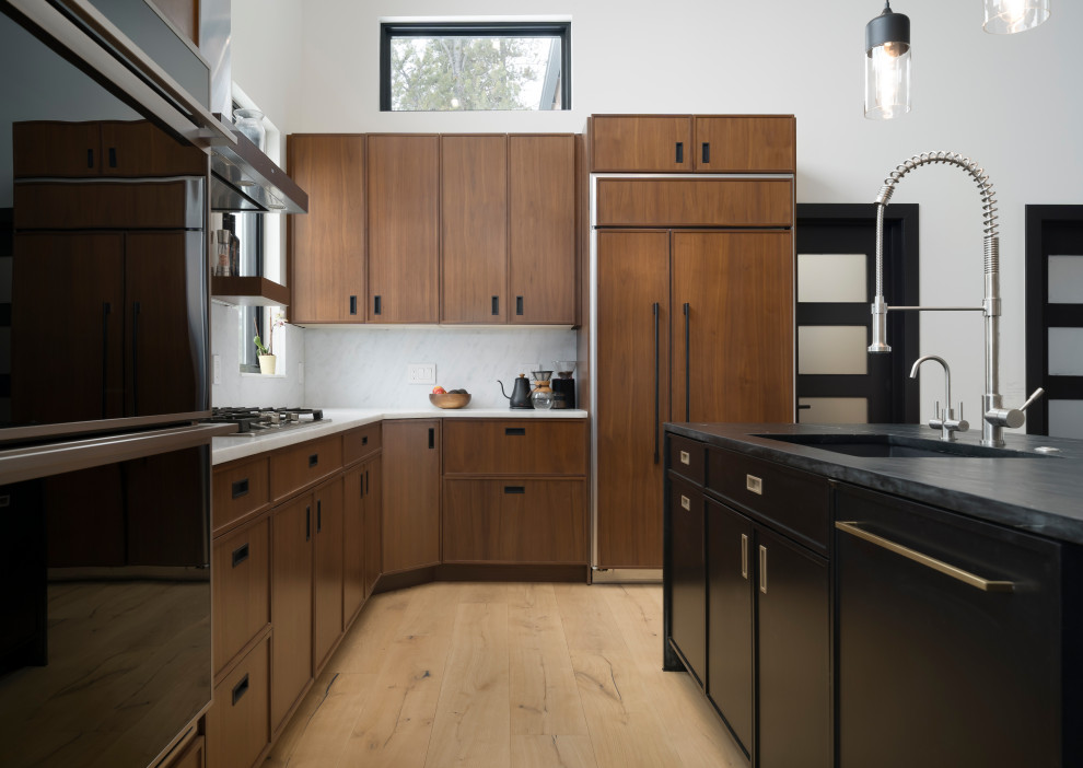Inspiration for a medium sized industrial l-shaped open plan kitchen in Denver with shaker cabinets, medium wood cabinets, marble worktops, integrated appliances, light hardwood flooring, an island, brown floors and multicoloured worktops.