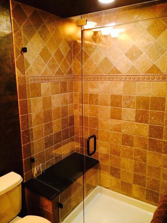 Transitional alcove shower photo in Denver with a two-piece toilet and a hinged shower door