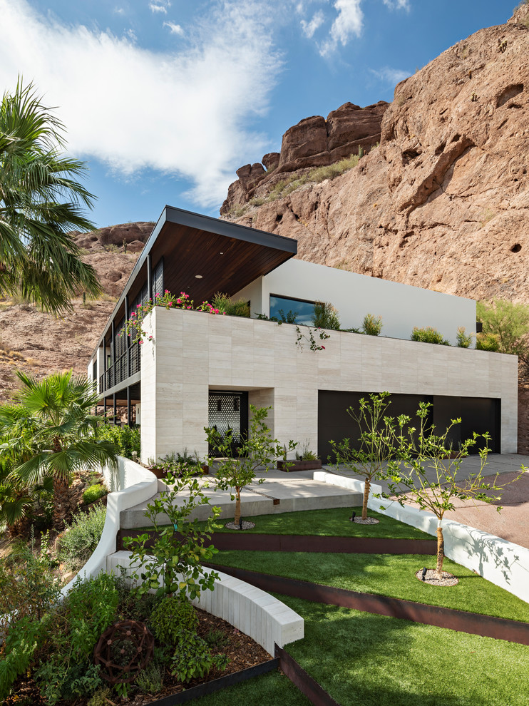 Inspiration for a modern two-storey house exterior in Phoenix.