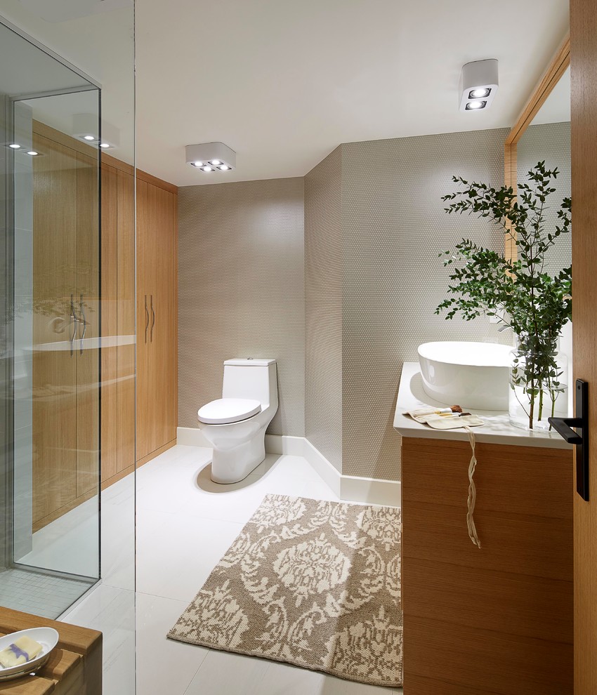 Design ideas for a mid-sized contemporary master bathroom in Montreal with flat-panel cabinets, light wood cabinets, engineered quartz benchtops, an open shower, a one-piece toilet, white tile, ceramic tile, grey walls and ceramic floors.