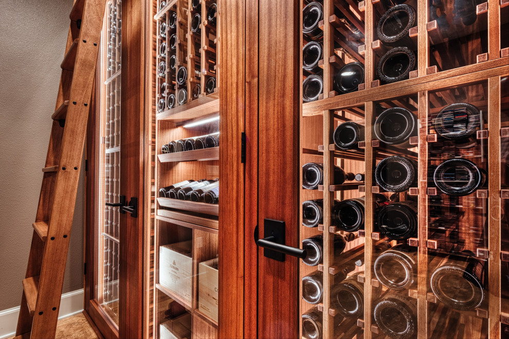 Design ideas for a small arts and crafts wine cellar in Portland with cork floors and storage racks.