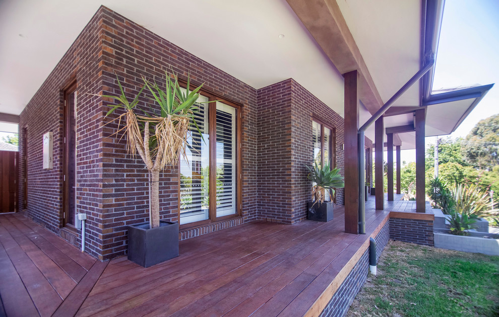 Design ideas for a large contemporary two-storey brick exterior in Melbourne.