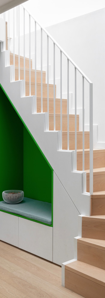 Medium sized contemporary wood wood railing staircase in Paris with wood risers.