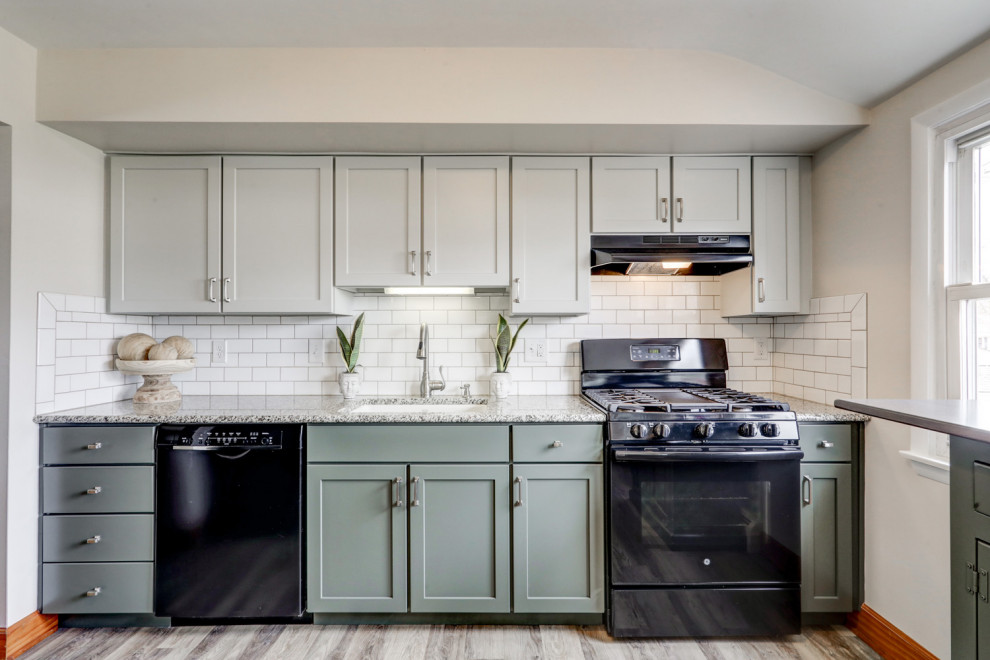 Inspiration for a mid-sized transitional l-shaped eat-in kitchen remodel with recessed-panel cabinets, green cabinets and a peninsula