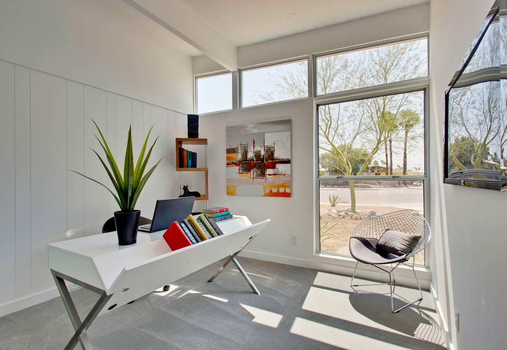 Mid-sized midcentury home office in Other with white walls, carpet and a freestanding desk.