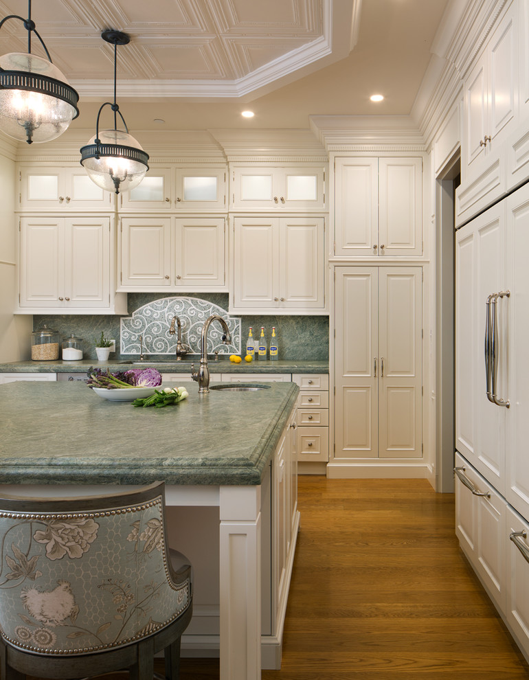 Inspiration for an expansive traditional u-shaped separate kitchen in San Diego with a drop-in sink, beaded inset cabinets, white cabinets, granite benchtops, green splashback, mosaic tile splashback, stainless steel appliances, medium hardwood floors, with island and brown floor.