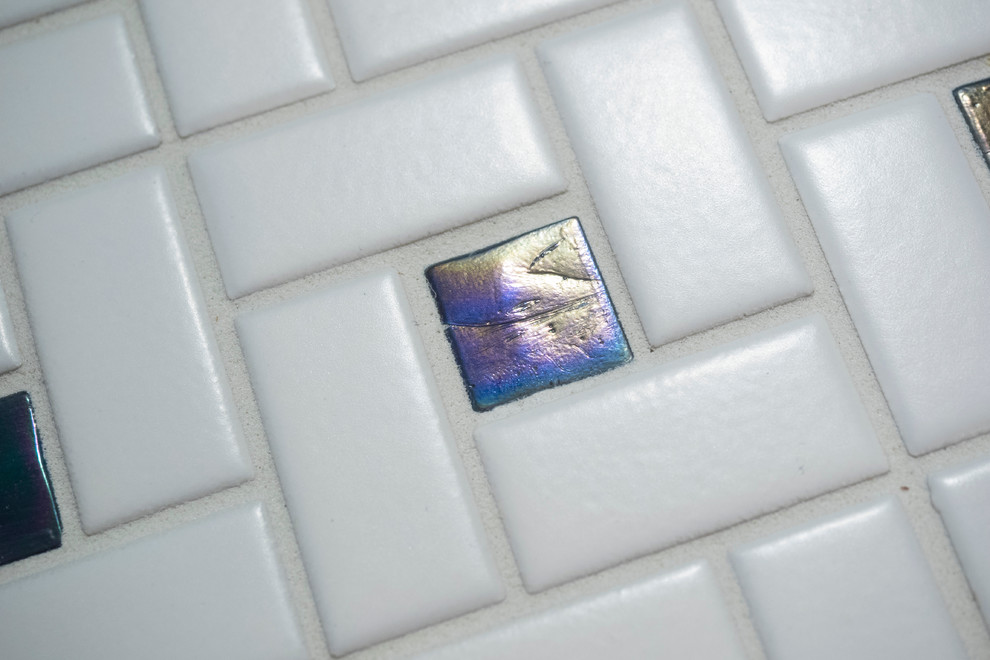 Example of a large transitional white tile and porcelain tile porcelain tile home design design with an undermount sink, flat-panel cabinets, white cabinets, granite countertops, a two-piece toilet and white walls