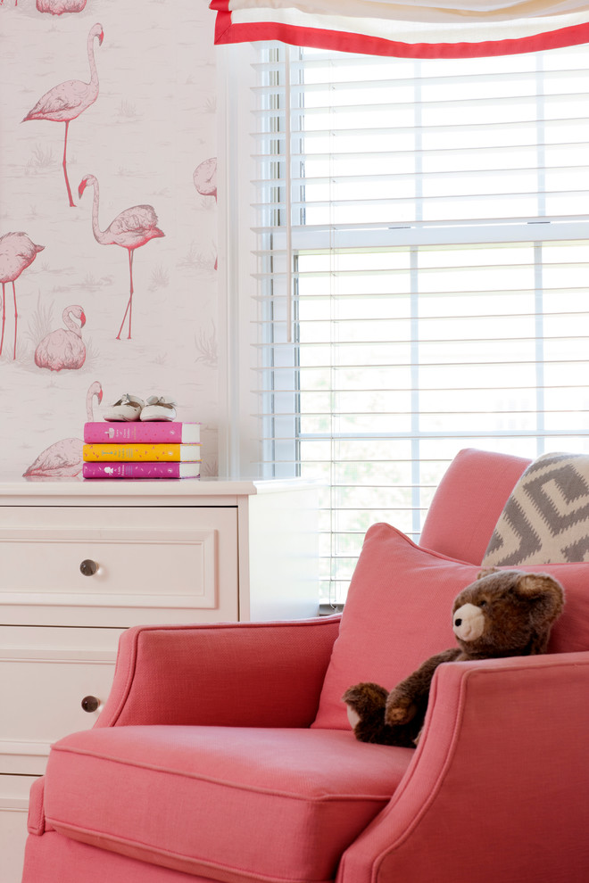 Bedroom and mid-sized transitional girl medium tone wood floor nursery photo in New York with multicolored walls