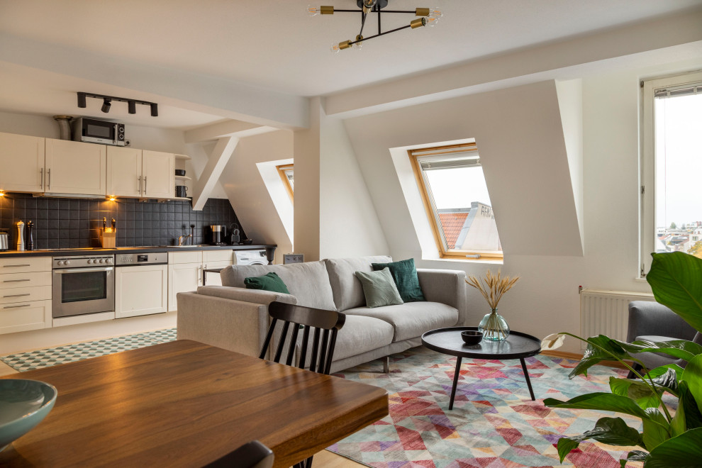 Living room - contemporary light wood floor and beige floor living room idea in Berlin with white walls