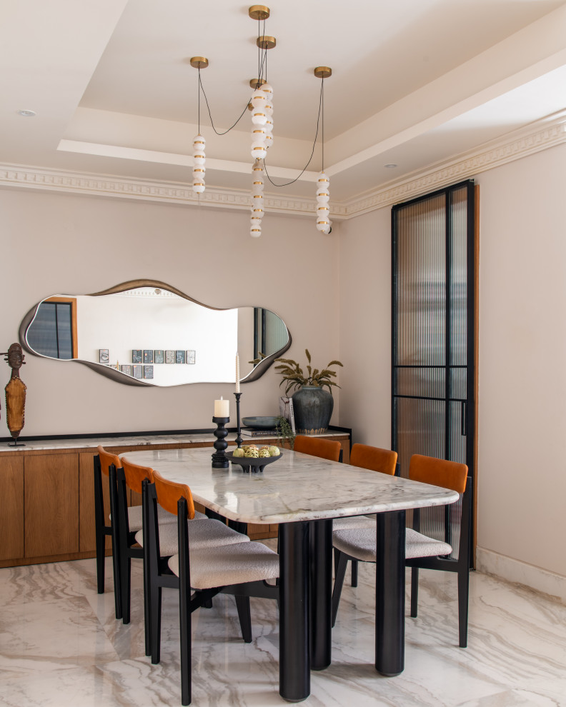 Inspiration for a contemporary dining room in Delhi With Grey Walls and Gray.