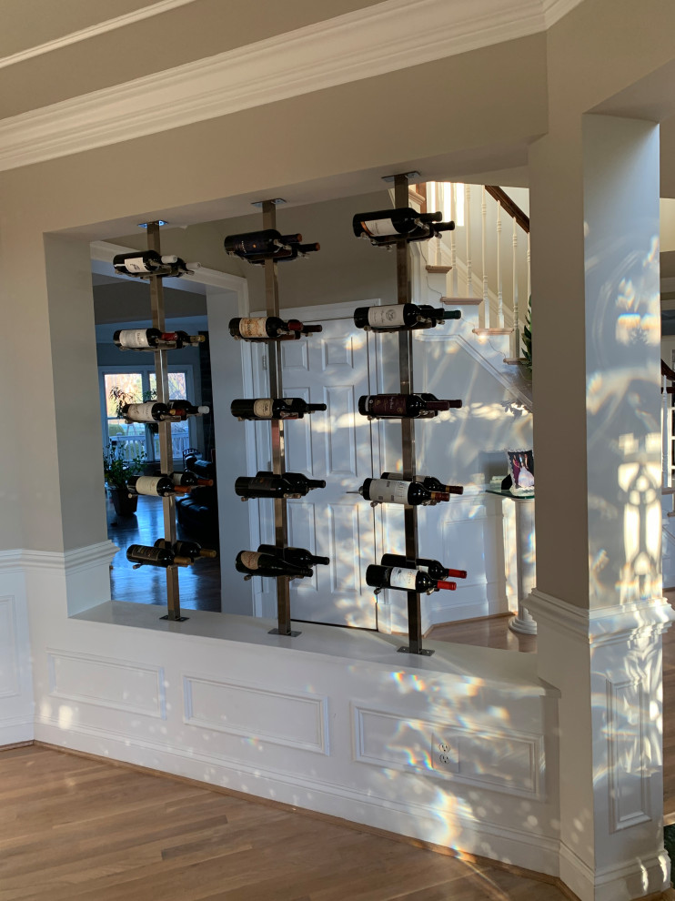 This is an example of a contemporary wine cellar in Other with display racks.