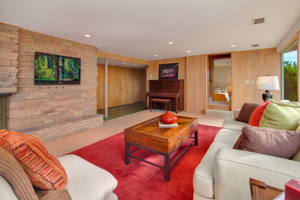 This is an example of a midcentury family room in Seattle.