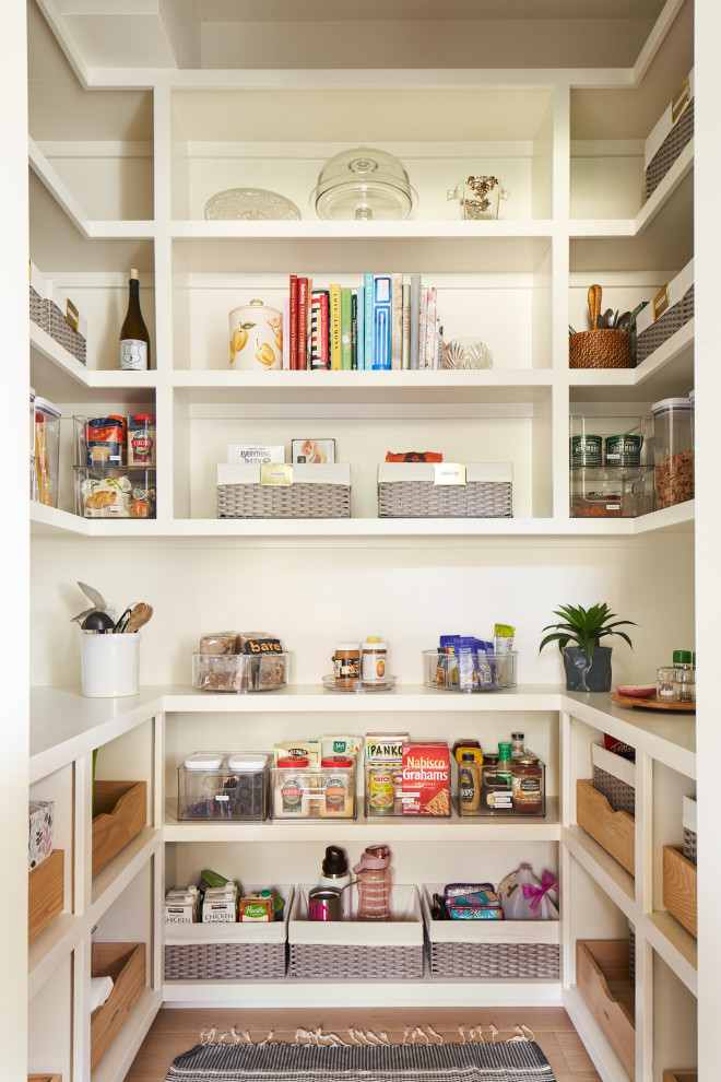 Mid-sized transitional single-wall medium tone wood floor kitchen pantry photo in Austin with beaded inset cabinets, green cabinets, multicolored backsplash, paneled appliances, an island and white countertops