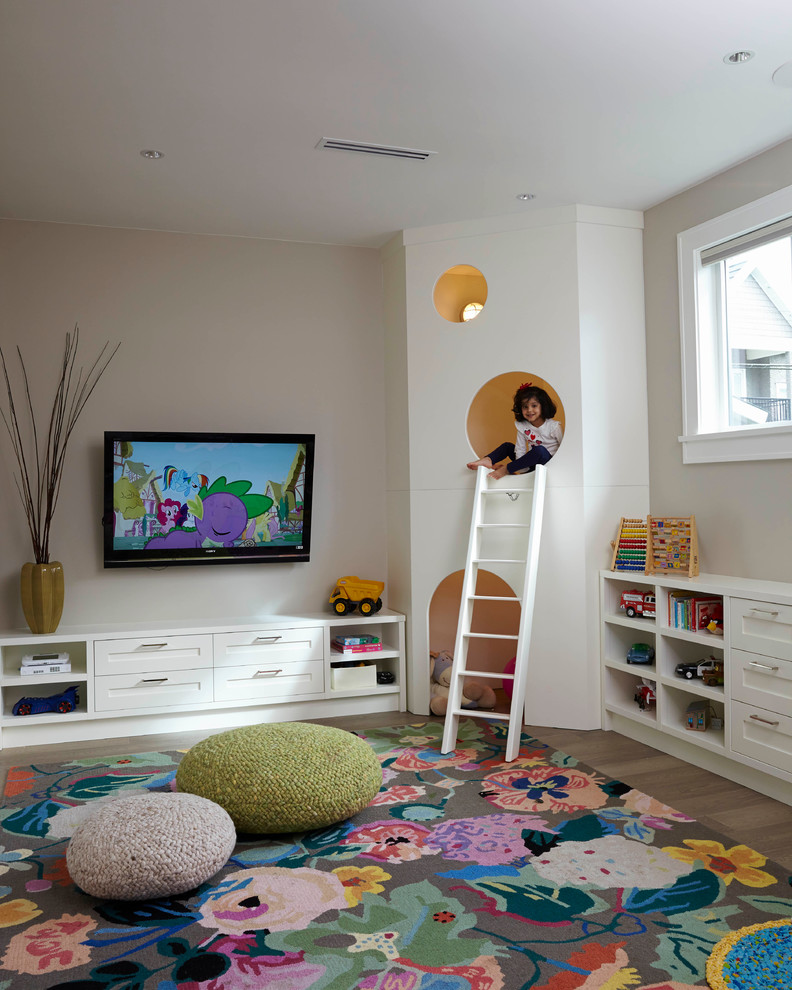 Inspiration for a transitional kids' playroom for girls in Vancouver with grey walls and medium hardwood floors.