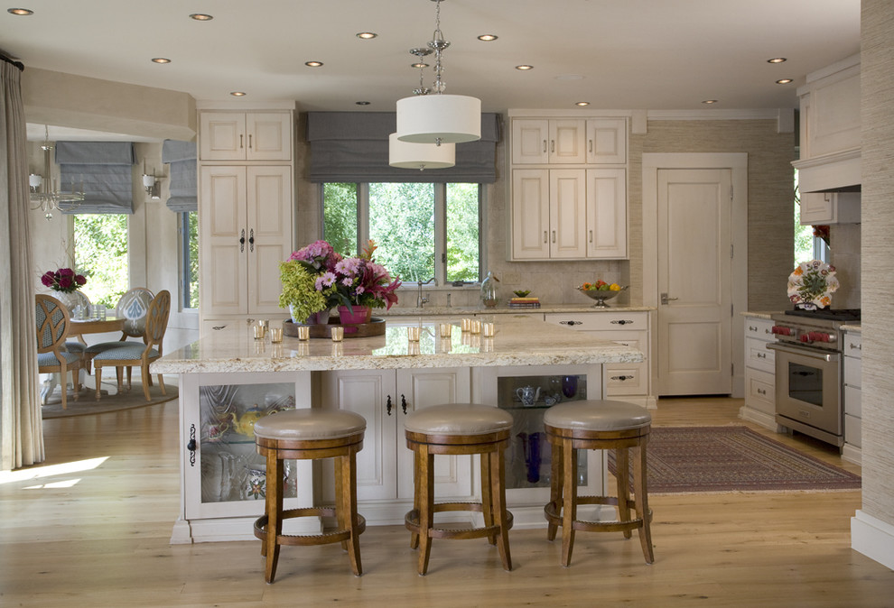 Design ideas for a traditional kitchen in Denver with raised-panel cabinets and stainless steel appliances.