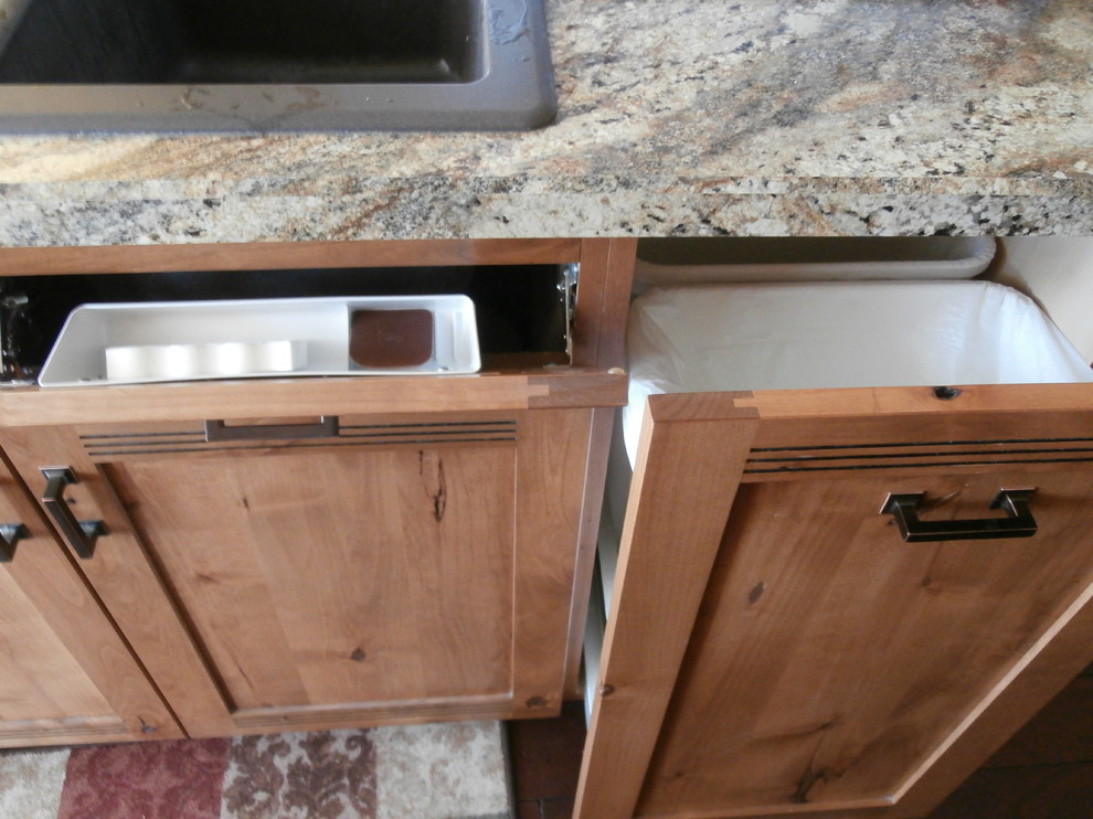 Inspiration for a large rustic single-wall dark wood floor and brown floor eat-in kitchen remodel with shaker cabinets, medium tone wood cabinets, laminate countertops, metallic backsplash, stainless steel appliances and two islands