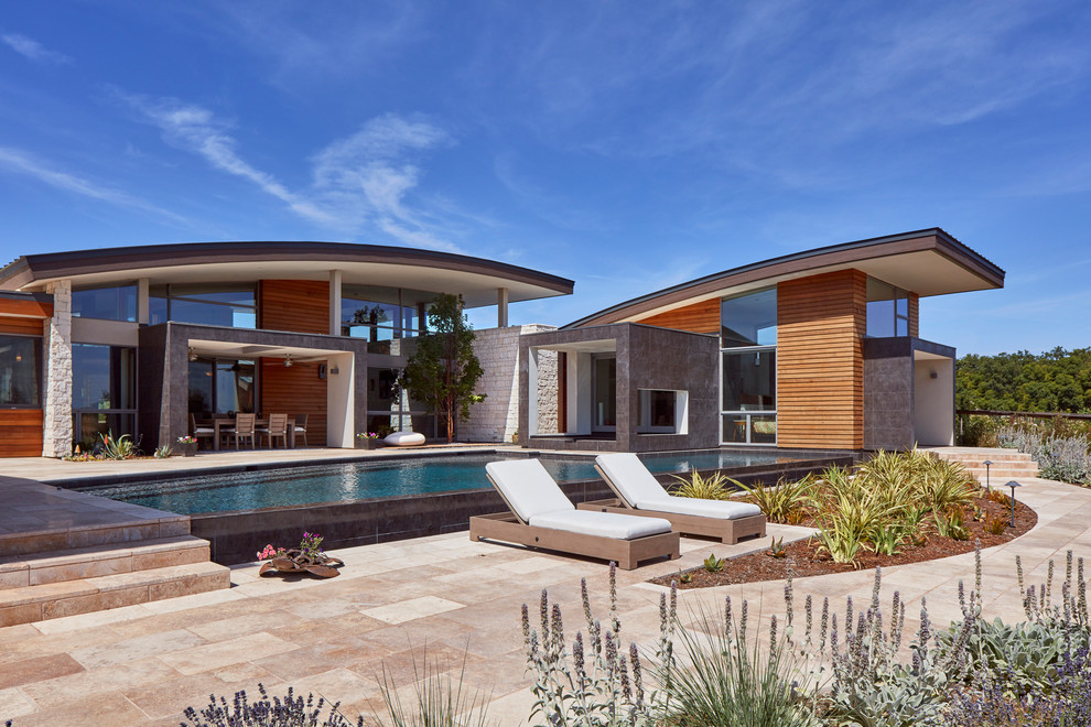 Design ideas for a contemporary house exterior in Sacramento with mixed siding.
