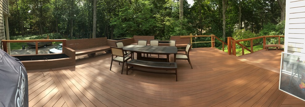 Large transitional rooftop deck container garden photo in Boston with a pergola