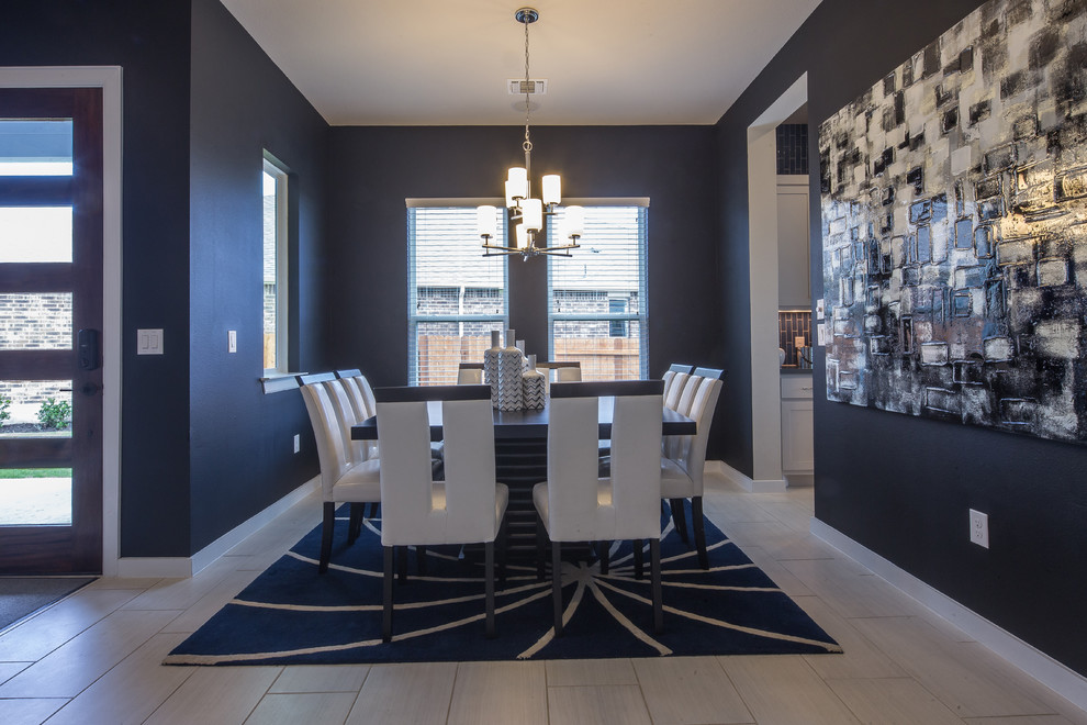 Photo of a mid-sized contemporary separate dining room in Austin with black walls, porcelain floors and no fireplace.