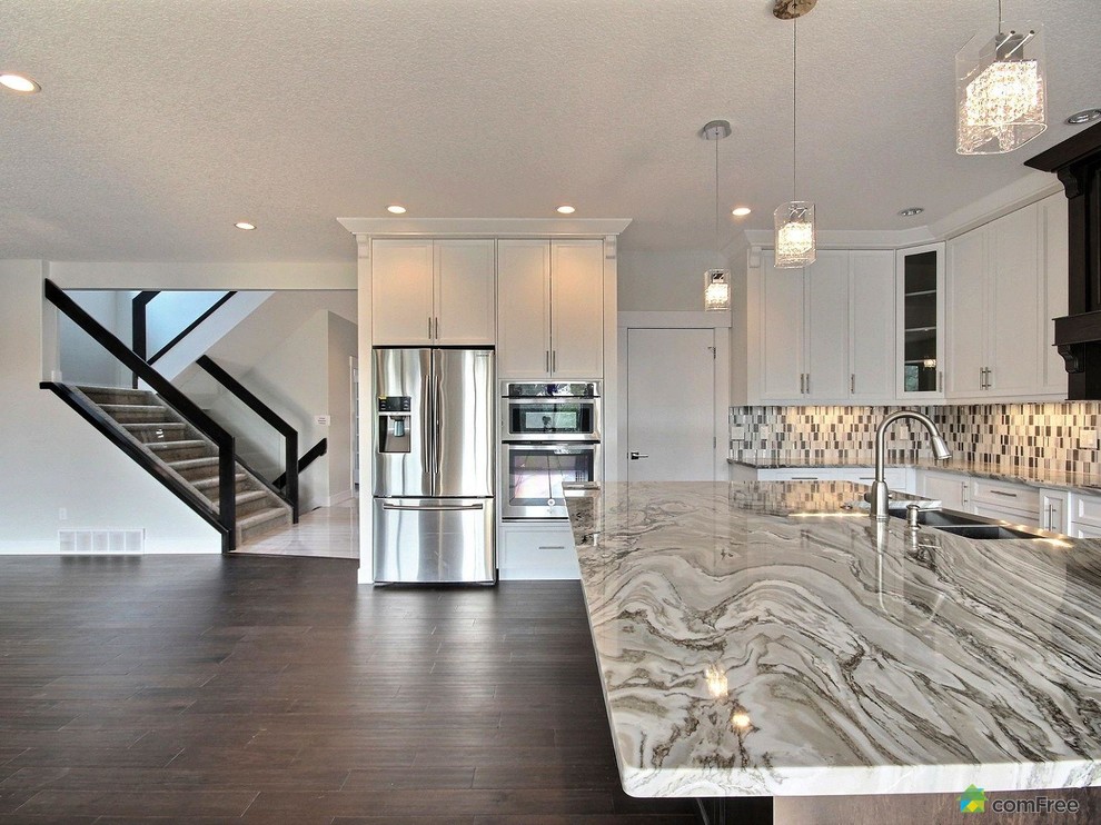 Transitional home design photo in Edmonton