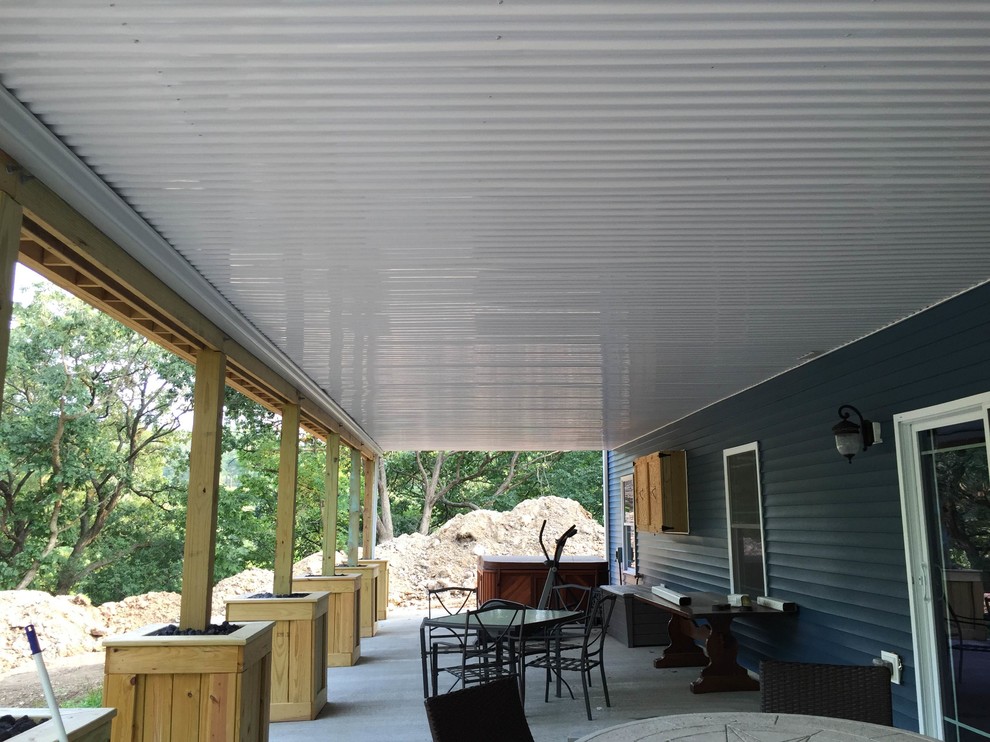 Backyard deck photo in Cedar Rapids with a pergola