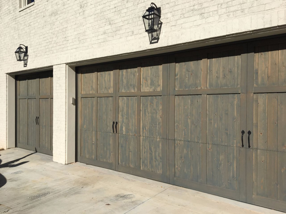 Inspiration for a rustic three-car garage remodel in Atlanta