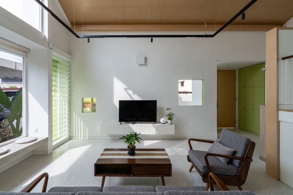 This is an example of a mid-sized asian formal open concept living room in Sydney with white walls, terra-cotta floors, a freestanding tv, white floor, timber and brick walls.