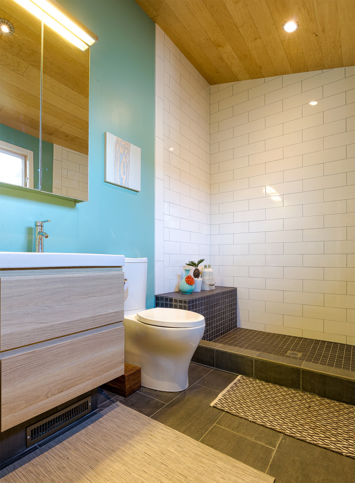 Photo of a contemporary bathroom in San Francisco with flat-panel cabinets, light wood cabinets, an open shower, a two-piece toilet, white tile, subway tile and an open shower.