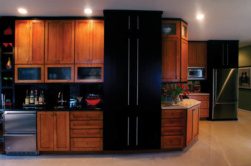 Example of a huge transitional eat-in kitchen design in Indianapolis with medium tone wood cabinets, black backsplash and black appliances
