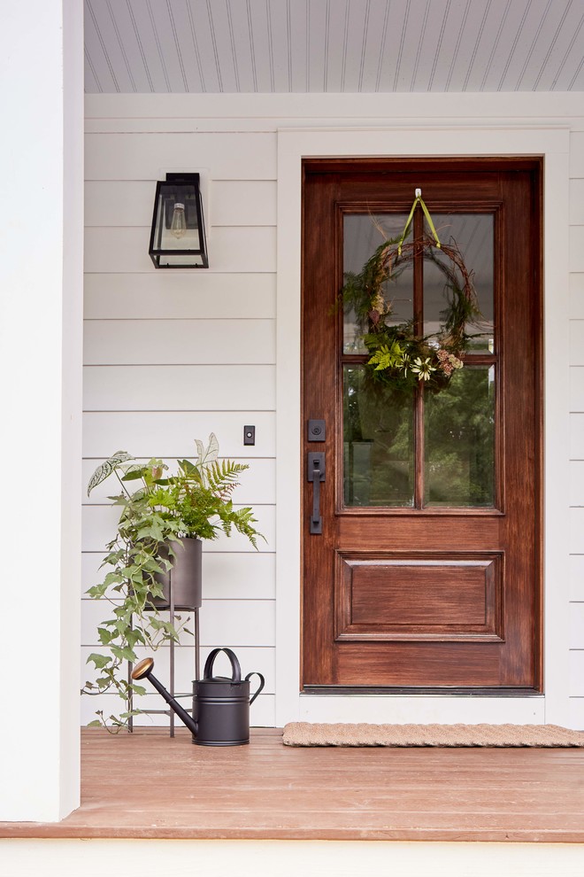 Rockville - Inspiration for a mid-sized country front porch remodel in Richmond with a dark wood front door, decking and a roof extension