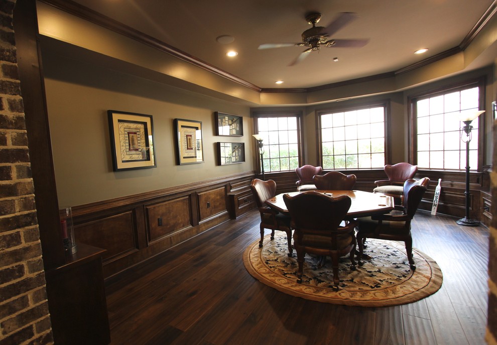 Inspiration for a huge transitional walk-out medium tone wood floor basement remodel with brown walls, a two-sided fireplace and a stone fireplace