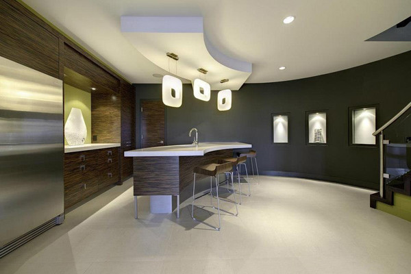 Design ideas for a large modern galley wet bar in Other with an undermount sink, flat-panel cabinets, medium wood cabinets, solid surface benchtops, green splashback, carpet, white floor and white benchtop.