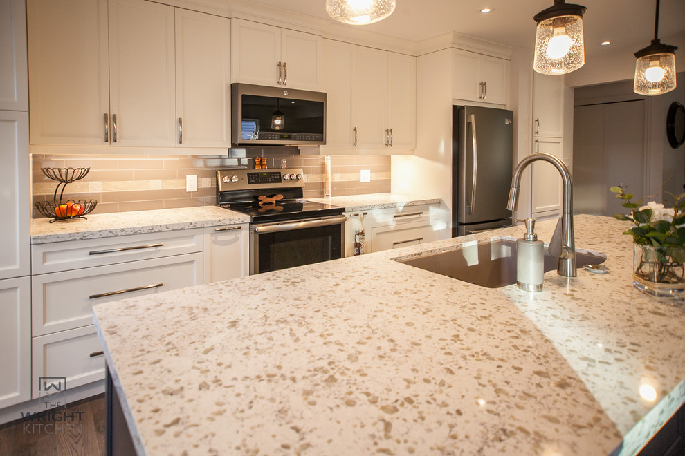 Example of a transitional kitchen design in Toronto