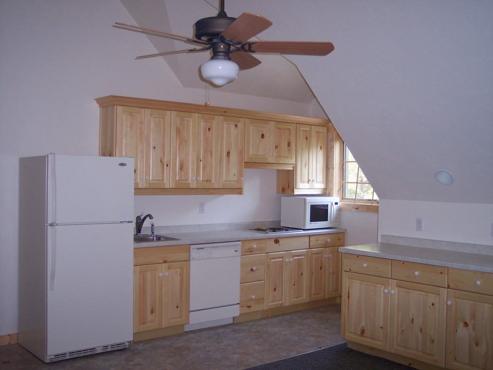 Inspiration for a small rustic galley vinyl floor and gray floor eat-in kitchen remodel with a drop-in sink, raised-panel cabinets, light wood cabinets, laminate countertops, white appliances, no island and gray countertops