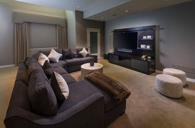 Example of a large transitional look-out carpeted and beige floor basement design in Philadelphia with gray walls and a home theater