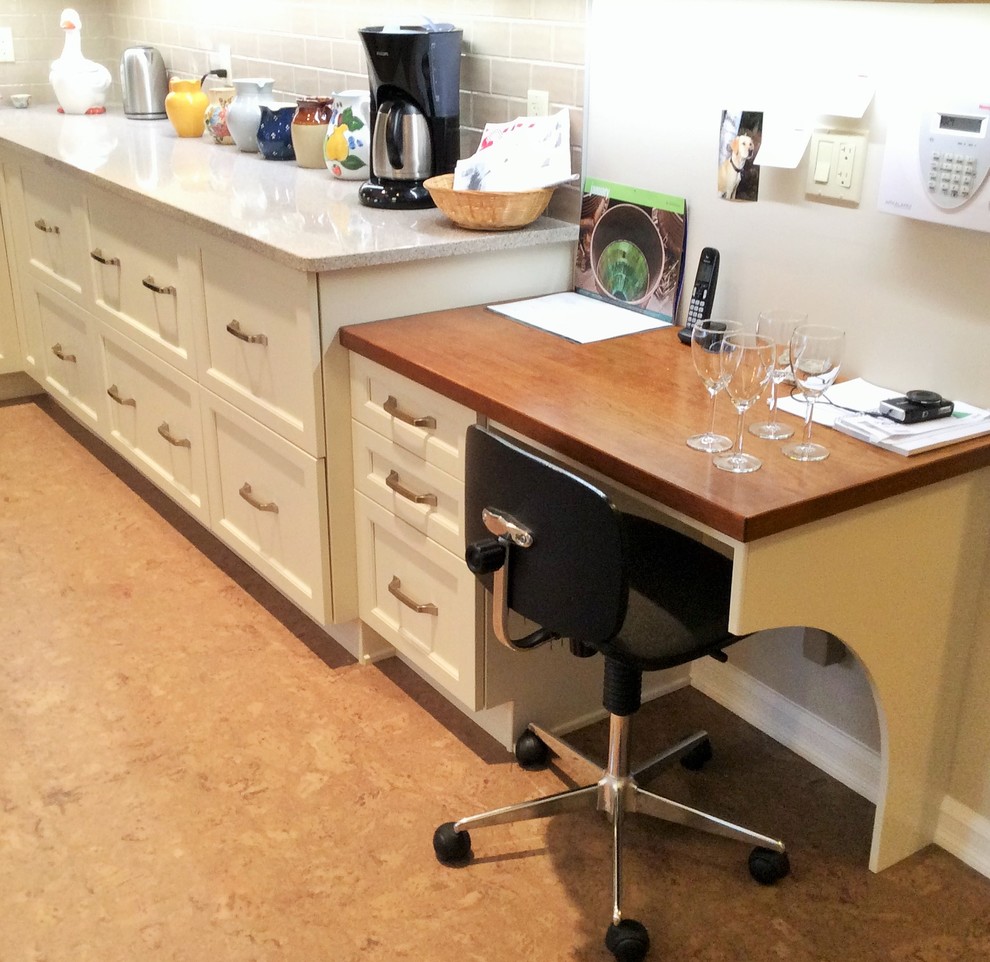 Transitional cork floor kitchen photo in Edmonton with white cabinets, quartzite countertops, gray backsplash, ceramic backsplash and stainless steel appliances