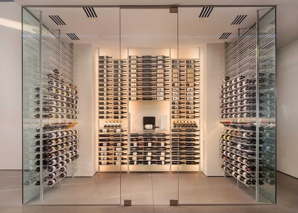 Example of a mid-sized minimalist porcelain tile and multicolored floor wine cellar design in Phoenix with storage racks