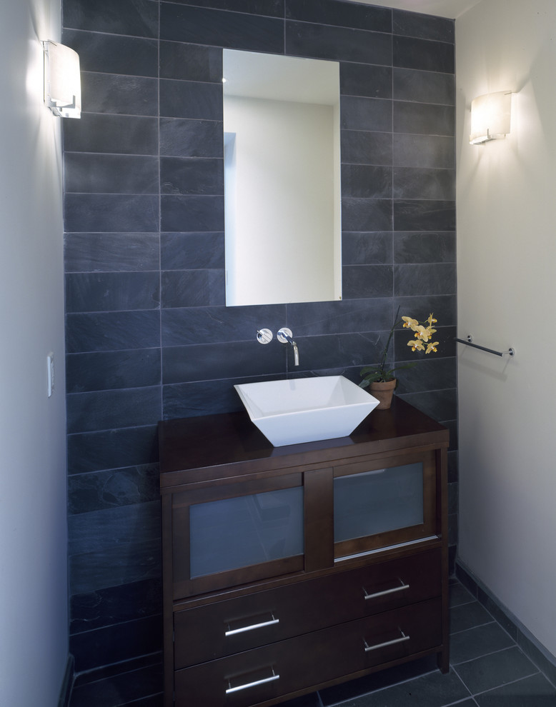 This is an example of a contemporary powder room in San Francisco with a vessel sink and slate.