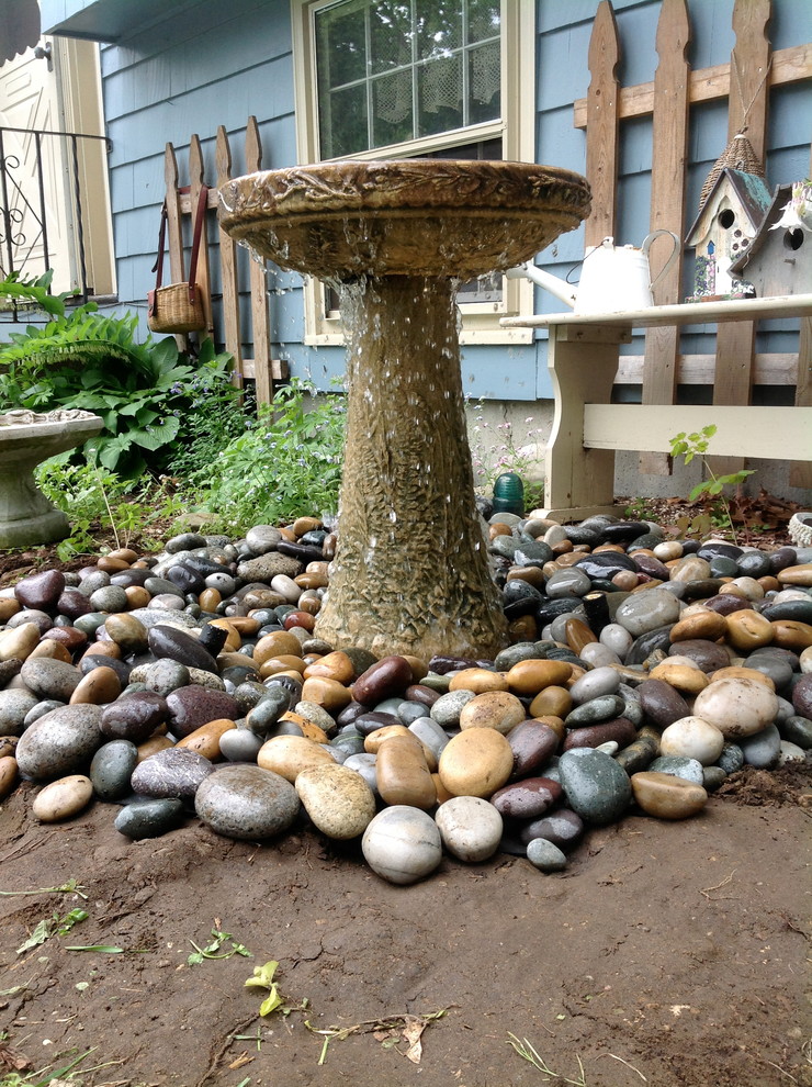 Photo of a traditional garden in Boston with a water feature.
