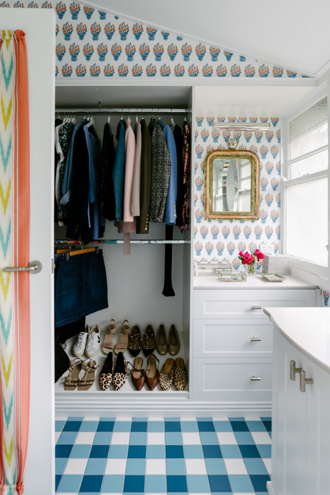 Design ideas for a country women's walk-in wardrobe in Brisbane with shaker cabinets, white cabinets, blue floor and vaulted.