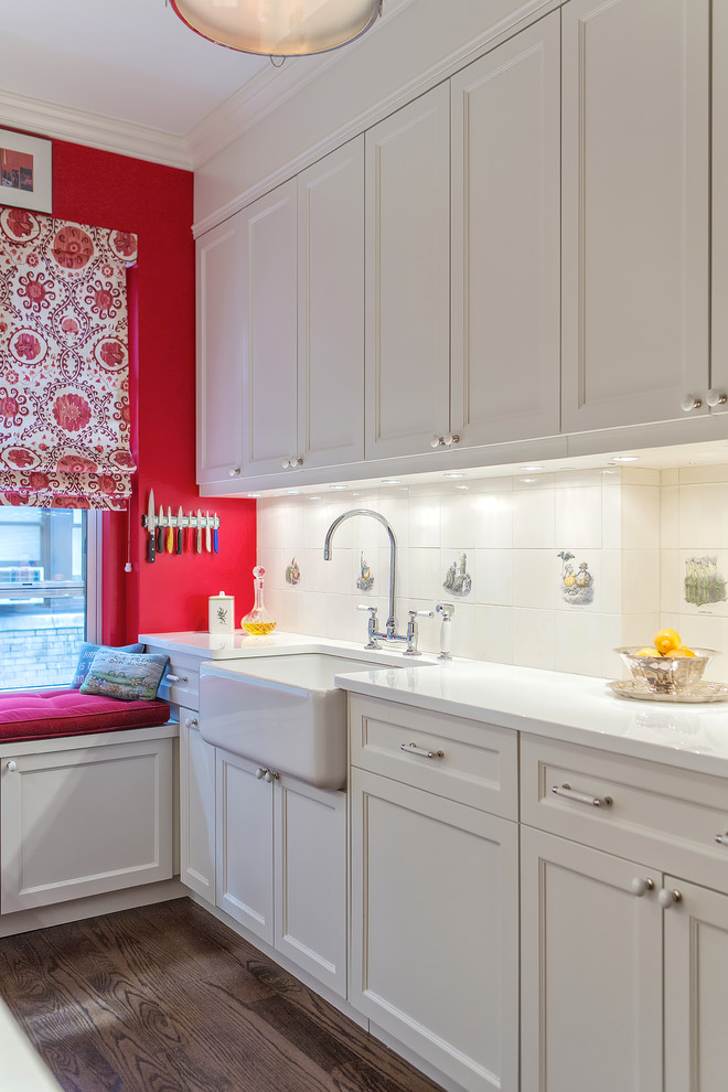 Photo of an eclectic kitchen in New York with white cabinets, coloured appliances and medium hardwood floors.