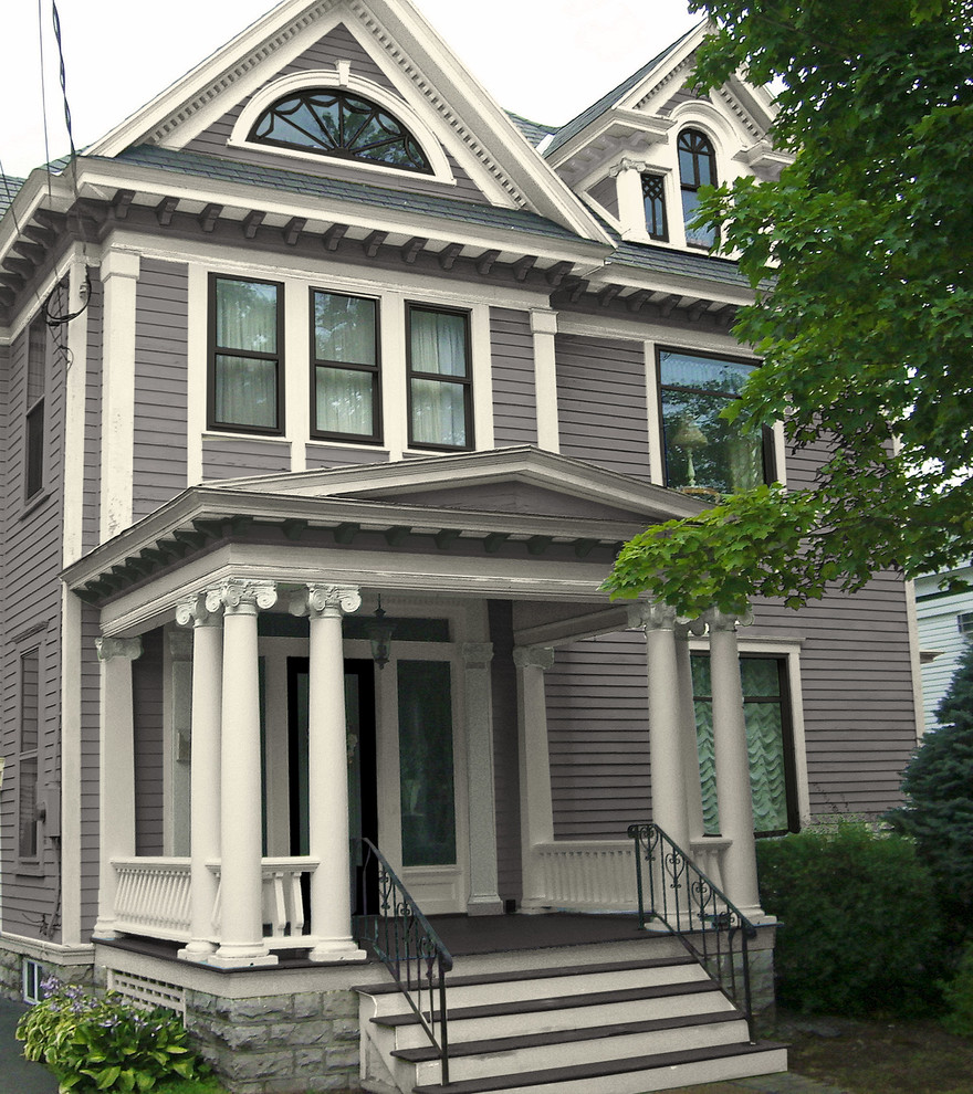 Inspiration for a large traditional three-storey grey exterior in New York with wood siding and a hip roof.