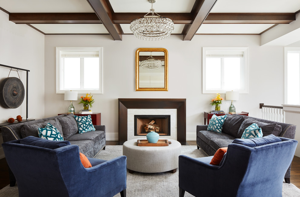Inspiration for a mid-sized transitional formal loft-style living room in Chicago with beige walls, dark hardwood floors, a standard fireplace, a wood fireplace surround, no tv and brown floor.