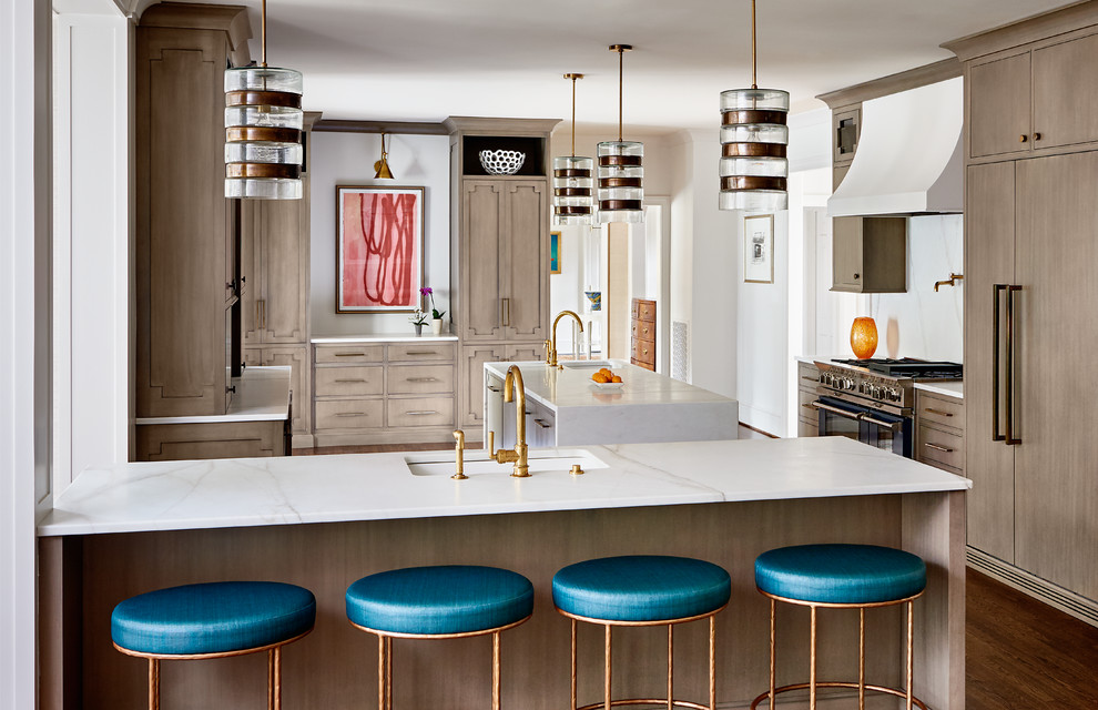 Example of a huge transitional u-shaped dark wood floor and brown floor eat-in kitchen design with an undermount sink, beaded inset cabinets, medium tone wood cabinets, marble countertops, white backsplash, marble backsplash, paneled appliances and two islands